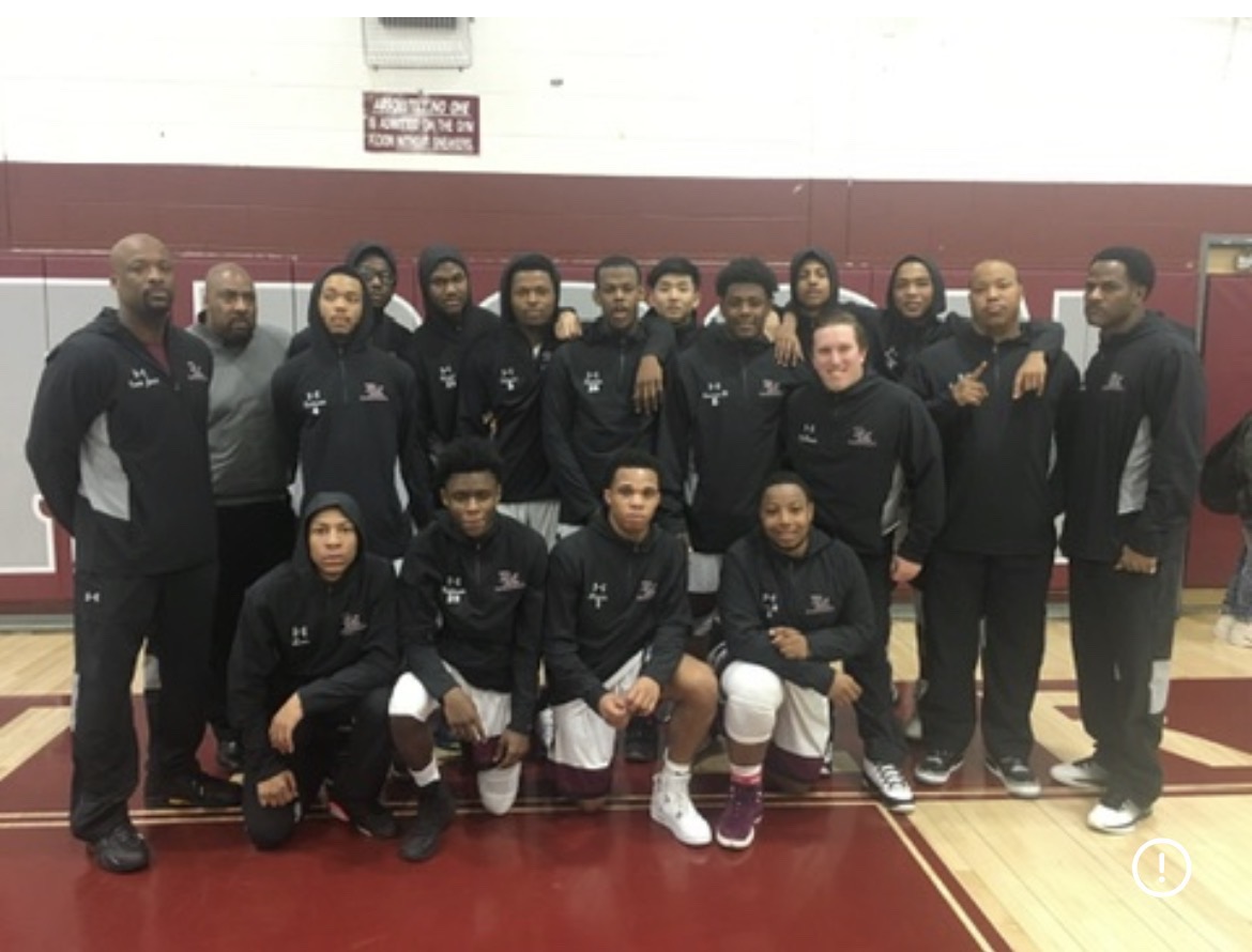 Coach Leo with his basketball team